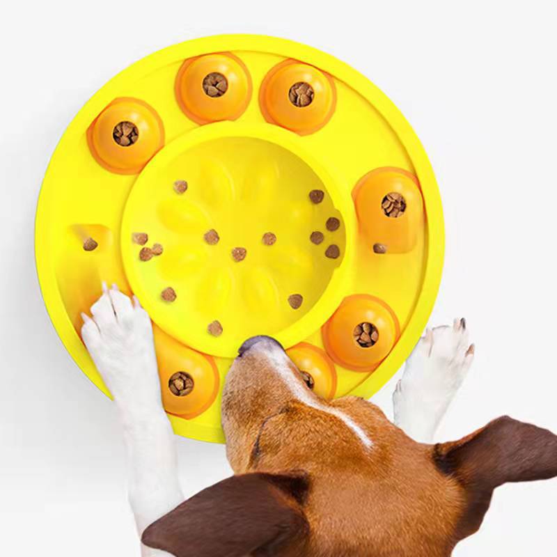Dog using an interactive puzzle feeder