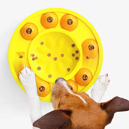 Dog using an interactive puzzle feeder