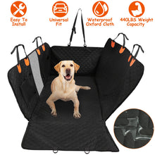 Black waterproof dog backseat cover installed in a car