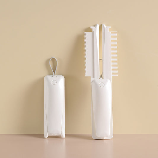 White folding pet grooming and hair-removal tool