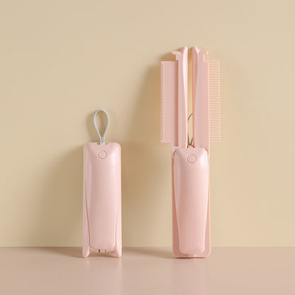 Pink folding pet grooming tool