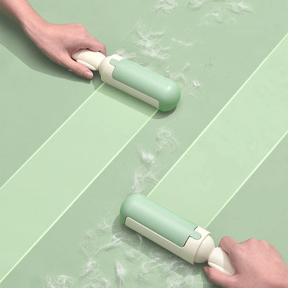 Pet hair remover roller cleaning a sofa