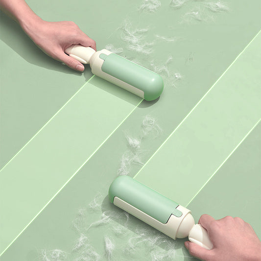 Pet hair remover roller cleaning a sofa
