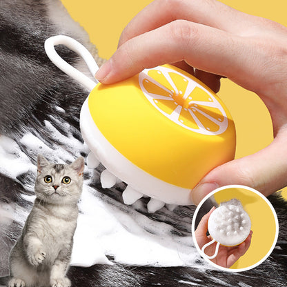 Yellow silicone pet bath brush used on a cat
