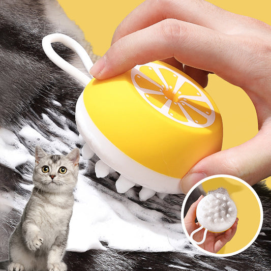 Yellow silicone pet bath brush used on a cat